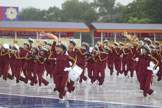 A marching band of state students perform during a destruction ceremony of seized illegal narcotics, marking International Day against Drug Abuse and Illicit Trafficking on the outskirts of Yangon, Myanmar, Monday, June 26, 2023. (Photo by Thein Zaw/AP Photo)