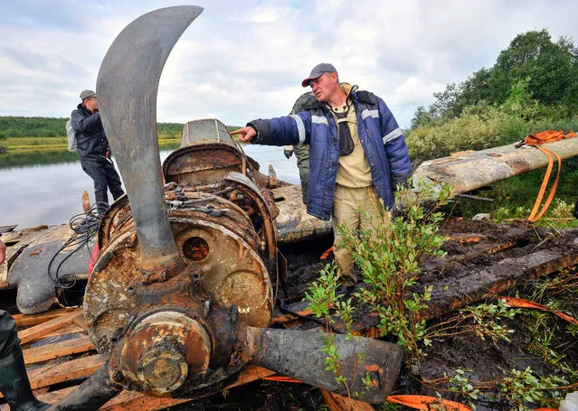 A WWII Ilyushin Il-2 ground attack aircraft retrieved from the bottom of a lake in Murmansk Region, Russia on August 10, 2018. During the 1941-45 Great Patriotic War, the Eastern Front of World War II, the aircraft was operated by Captain Alexander Kalichev, the former commander of the 46 th aviation regiment of the Russian Northern Fleet; on August 22, 1943, the Ilyushin Il-2 attack aircraft was shot down during the assault of the Luostari airbase. The aircraft is to be transported to the city of Novosibirsk for restoration. (Photo by Lev Fedoseyev/TASS)