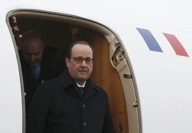 France's President Francois Hollande walks out of a plane upon his arrival at an airport near Minsk, February 11, 2015. (Photo by Valentyn Ogirenko/Reuters)