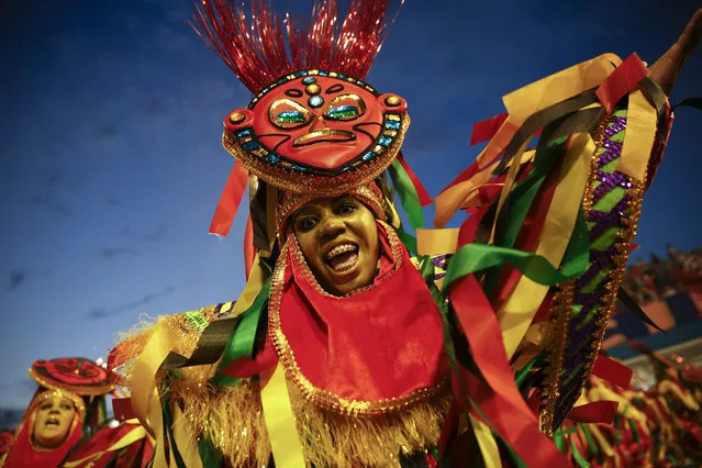 A dancer from the Nene de Vila Matilde samba school performs during a carnival parade in Sao Paulo, Brazil, Saturday, February 14, 2015. (Photo by Andre Penner/AP Photo)