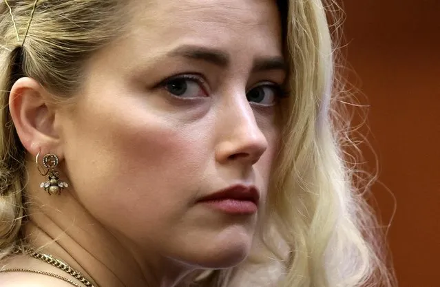 US actress Amber Heard waits before the jury announced a split verdict in favor of both Johnny Depp and Amber Heard on their claim and counter-claim in the Depp v. Heard civil defamation trial at the Fairfax County Circuit Courthouse in Fairfax, Virginia, on June 1, 2022. A US jury on Wednesday found Johnny Depp and Amber Heard defamed each other, but sided far more strongly with the “Pirates of the Caribbean” star following an intense libel trial involving bitterly contested allegations of sеxual violence and domestic abuse. (Photo by Evelyn Hockstein/Pool via AFP Photo)