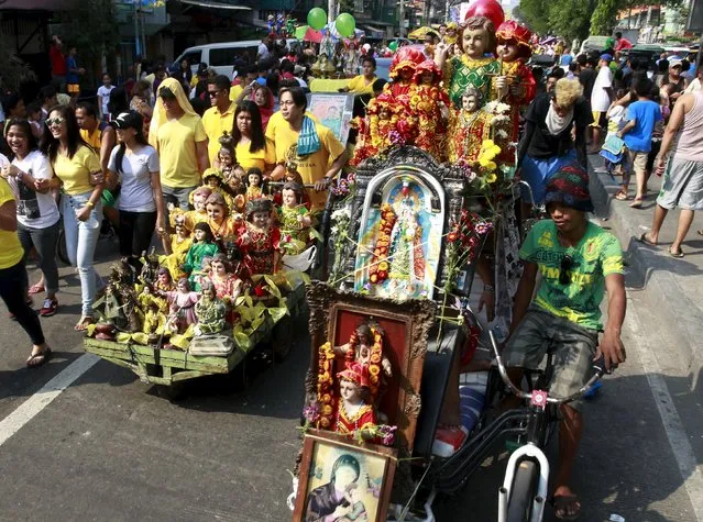 Devotees parade different Sto. Nino (infant Jesus) replicas during a procession in Manila January 16, 2016, a day before the annual of the feast day of Sto. Nino on Sunday. (Photo by Romeo Ranoco/Reuters)
