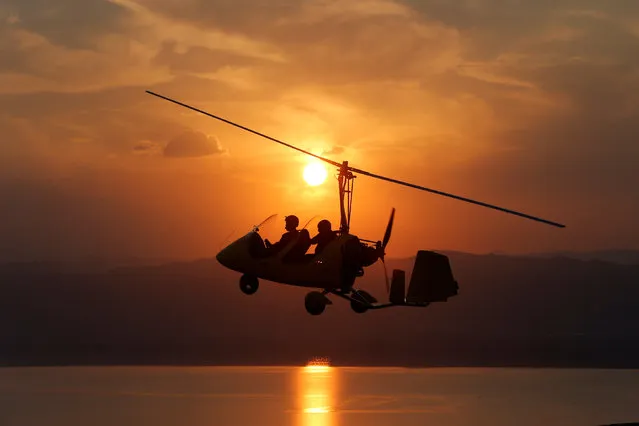 The Royal Aero Sports Club of Jordan plane known as a gyrocopter flies to provide tourists and visitors with a bird's eye view of the Dead Sea, Jordan, November 13, 2018. (Photo by Muhammad Hamed/Reuters)
