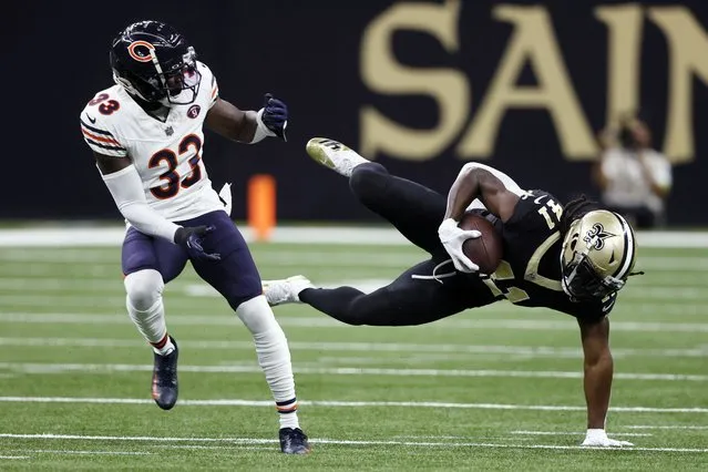 New Orleans Saints running back Alvin Kamara (41) makes a catch next to Chicago Bears cornerback Jaylon Johnson (33) during the first half of an NFL football game in New Orleans, Sunday, November 5, 2023. (Photo by Butch Dill/AP Photo)