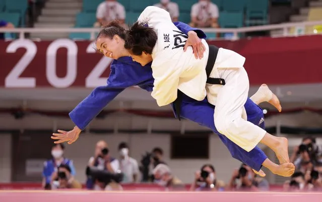 Uta Abe (white) of Team Japan and Chelsie Giles of Team Great Britain compete in the Women's -52kg quarter final on day two of the Tokyo 2020 Olympic Games at Nippon Budokan on July 25, 2021 in Tokyo, Japan. (Photo by Hannah Mckay/Reuters)