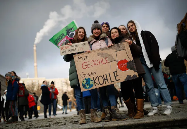 Students and pupils demonstrate as part of the “Fridays for Future” protest with banners, on January 25, 2019 in front of the Economy Ministry in Berlin where the members of the coal commission meet. The so-called “Kohlekommission” (coal commission), a governmental commission for growth, structural change and employment is to announce a roadmap for exiting coal as part of efforts to make Germany carbon-neutral by 2050. (Photo by Odd Andersen/AFP Photo)