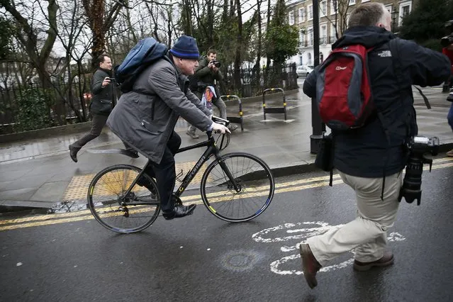 London Mayor Boris Johnson cycles off after speaking to the media in front of his home in London, Britain February 22, 2016. Johnson threw his weight on Sunday behind the campaign to leave the European Union, dealing a blow to David Cameron by increasing the chance British voters will ditch membership in a June referendum. (Photo by Stefan Wermuth/Reuters)
