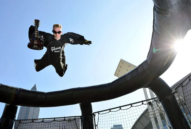 “Bodyflyer” Anton Berzin performs at the 'Frankfurter Musikmesse' at the “Gibson AIRDOME” with the guitar “Gibson Les Paul” on April 14, 2015 in Frankfurt am Main, Germany. Brave guitarists can perform “weightless” in the unique plant in Europe, in an air flow of more than 180 km/h lifting them up to 10 meters into the air. From 15 to 18 April 2015, Frankfurt am Main will be the international hotspot for over 65.000 visitors from 120 countries. (Photo By Thomas Lohnes/Getty Images)