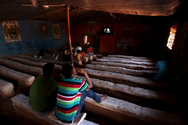 Eritrean refugees watch a movie in a makeshift cinema hall in Mai-Aini refugee camp near the Eritrean boarder in the Tigrai region in Ethiopia February 10 2016. (Photo by Tiksa Negeri/Reuters)