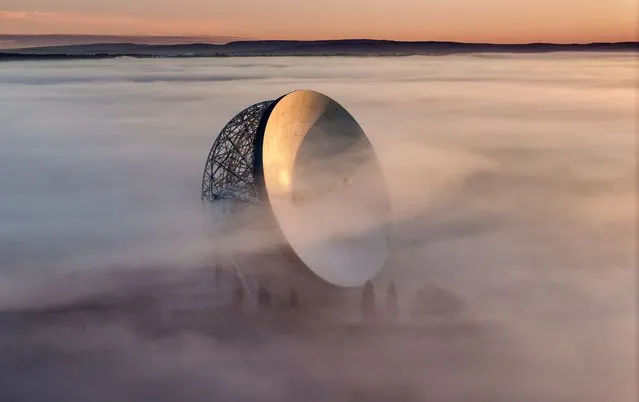 In this aerial view the Lovell Telescope at Jodrell Bank emerges above morning fog at sunrise on the Cheshire plain on October 25, 2023 in Holmes Chapel, United Kingdom. After exceptional rainfall last weekend which led to flooding in some areas low temperatures are bringing on autumnal weather conditions. (Photo by Christopher Furlong/Getty Images)