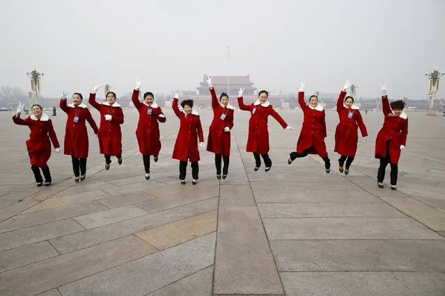 Hostesses jump for pictures at the Tiananmen Square during the opening session of the Chinese People's Political Consultative Conference (CPPCC) at the near-by Great Hall of the People in Beijing, China, March 3, 2016. (Photo by Damir Sagolj/Reuters)