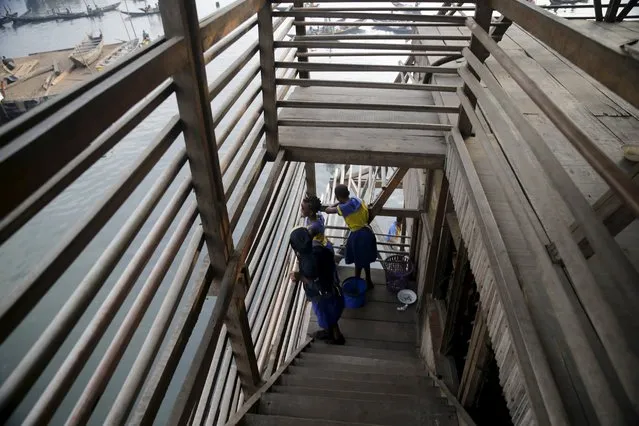 Students stand on the terrace near the entrance of a classroom at a floating school in the Makoko fishing community on the Lagos Lagoon, Nigeria February 29, 2016. (Photo by Akintunde Akinleye/Reuters)