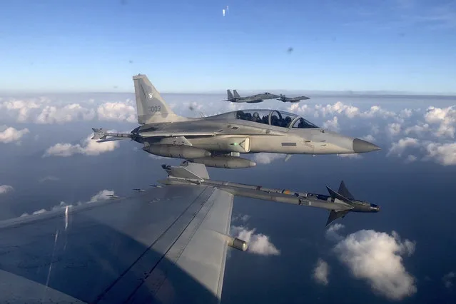 In this handout photo released by the Philippine Air Force, a Philippine Air Force FA-50PH jet fighter, joins the maritime patrol of the Philippines and the United States over Batanes and areas in the West Philippine Sea on Tuesday, November 21, 2023. The United States and Philippines are conducting joint air and maritime patrols in the South China Sea, which come as the two countries step up cooperation in the face of growingly aggressive Chinese activity in the area. (Photo by Philippine Air Force via AP Photo)