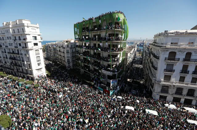 People gather during a protest over President Abdelaziz Bouteflika's decision to postpone elections and extend his fourth term in office, in Algiers, Algeria on March 15, 2019. (Photo by Zohra Bensemra/Reuters)