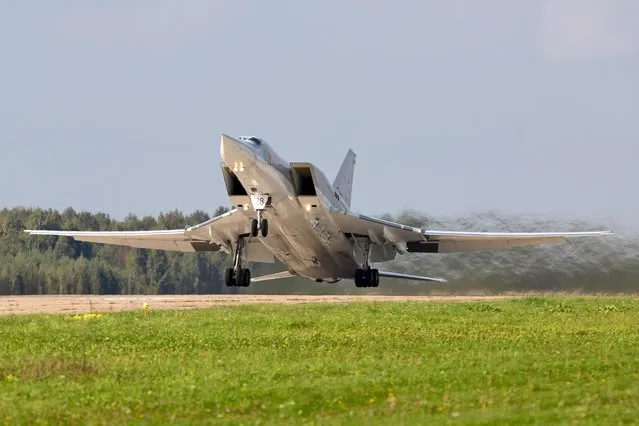 A Russian Tupolev Tu-22M3 strategic bombe takes off from Shaykovka Air Base during the active phase of the military exercises “Zapad-2021” staged by the armed forces of Russia and Belarus in Kaluga Region, Russia, September 13, 2021. (Photo by Russian Defence Ministry Press Service/Handout via Reuters)