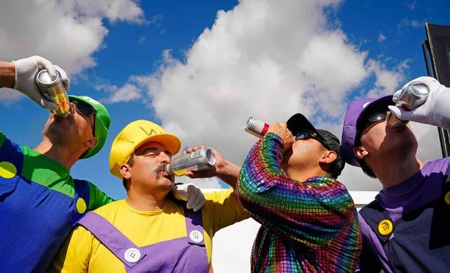 Costumed golf fans – from left, Grant Collinson, Cody Zavala, Juan Ruiz and Brett Beehler – drink beers while attending the WM Phoenix Open on Saturday, February 10, 2024. The tournament is renowned for its raucous atmosphere, but there were various crowd-related incidents this week that included arrests, fights and clashes between golfers and fans. (Photo by Patrick Breen/USA Today Sports via Reuters)
