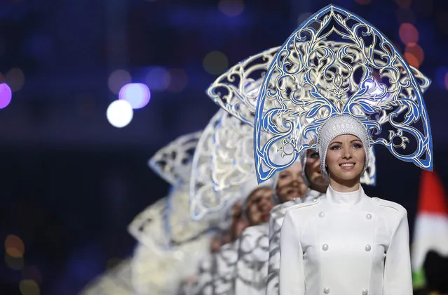 Performers line up during the closing ceremony of the 2014 Winter Olympics, Sunday, February 23, 2014, in Sochi, Russia. (Photo by Darron Cummings/AP Photo)