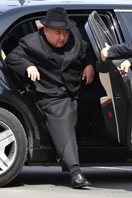 North Korean leader Kim Jong Un gets out of his car for a ceremony upon his departure from Russia, outside the railway station in the far-eastern Russian port of Vladivostok on April 26, 2019. (Photo by Yuri Kadobnov/AFP Photo)