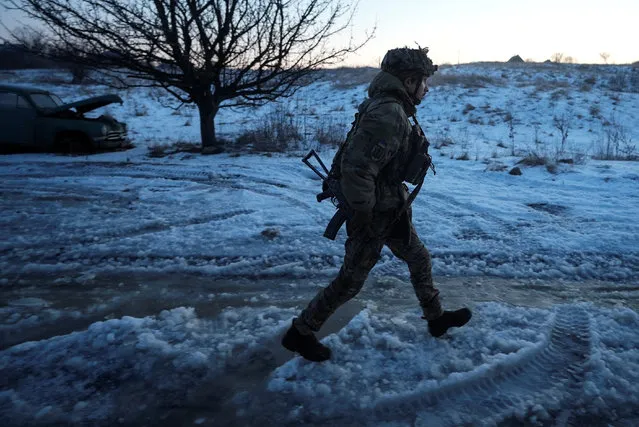 A Ukrainian serviceman of the Rarog UAV squadron of the 24th Separate Mechanized Brigade walks at a position near the town of Horlivka, in Donetsk region, Ukraine, on January 17, 2024. (Photo by Inna Varenytsia/Reuters)