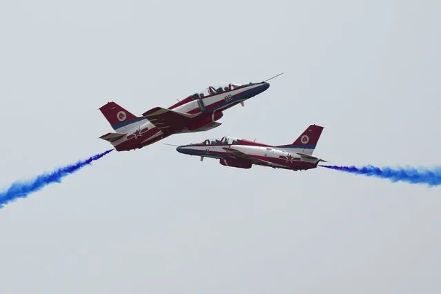 Members of the Chinese People's Liberation Army (PLA) Air Force Aviation University's “Red Falcon” Air Demonstration Team perform during the 13th China International Aviation and Aerospace Exhibition, also known as Airshow China 2021, on Tuesday, Sept. 28, 2021 in Zhuhai in southern China's Guangdong province. (Photo by Ng Han Guan/AP Photo)