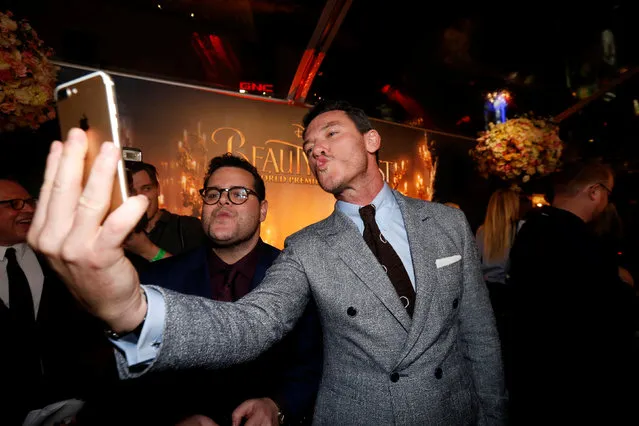 Cast members Luke Evans and Josh Gad record a video message at the premiere of “Beauty and the Beast” in Los Angeles, California, U.S. March 2, 2017. (Photo by Mario Anzuoni/Reuters)