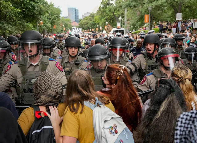 Texas state troopers in riot gear try to break up a pro-Palestinian protest at the University of Texas, during the ongoing conflict between Israel and the Palestinian Islamist group Hamas, in Austin, Texas, April 24, 2024. (Photo by Jay Janner/USA Today Network via Reuters)