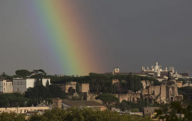 A rainbow appears over the Palatine Hill, above the Roman Forum, in Rome Thursday, November 10, 2016. (Photo by Alessandra Tarantino/AP Photo)