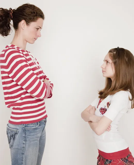 Mother and daughter (10-11 years) having argument, standing face to face. (Photo by Jamie Grill/Getty Images/Tetra images RF)