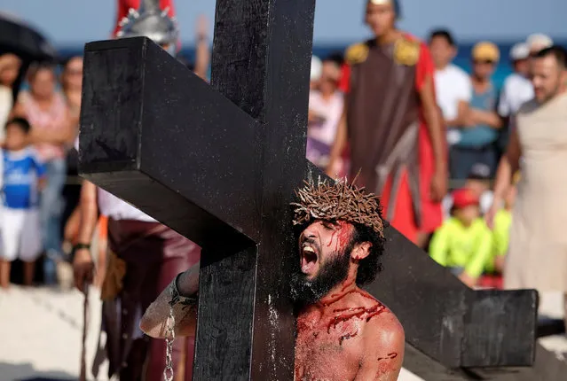 An actor portraying Jesus Christ takes part in a re-enactment of the Via Crucis (Way of the Cross) during Good Friday celebrations in Cancun, Mexico April 14, 2017. (Photo by Victor Ruiz Garcia/Reuters)
