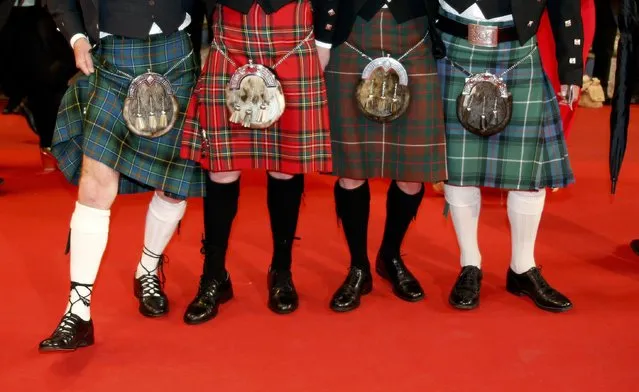 Guests wearing kilts pose on the red carpet as they arrive for the screening of the film “La danseuse” (The Dancer) in competition for the category “Un Certain Regard” at the 69th Cannes Film Festival in Cannes, France, May 13, 2016. (Photo by Jean-Paul Pelissier/Reuters)