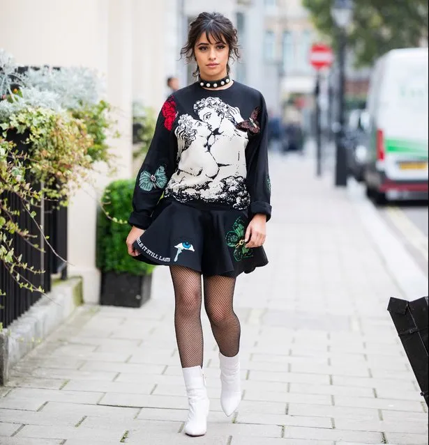 American-Cuban singer Camila Cabello is seen wearing total look Valentino bag, dress with graphic print, sheer tights, white ankle boots on October 03, 2019 in London, England. (Photo by Christian Vierig/GC Images)