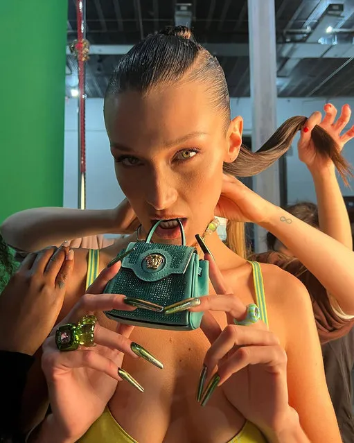 American model Bella Hadid holds a tiny green purse end of March 2022. (Photo by bellahadid/Instagram)