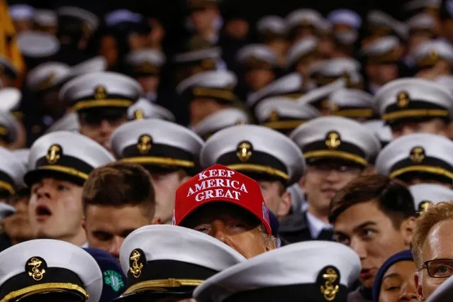 U.S. President Donald Trump greets U.S. Naval Academy Midshipmen during the annual Army-Navy collegiate football game at Lincoln Financial Field in Philadelphia, PA, U.S., December 14, 2019. (Photo by Tom Brenner/Reuters)