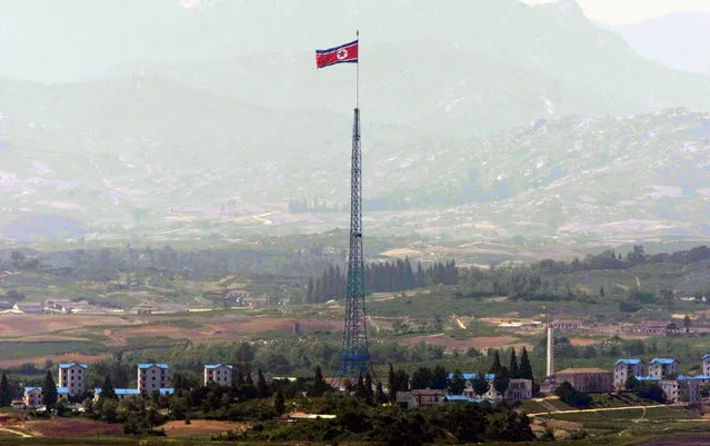 In this Wednesday, May 27, 2009, file photo, a giant North Korean flag flutters on the top of a 160-meter (533-foot) tower in North Korea as it is pictured from the demilitarized zone (DMZ) near the border village of Panmunjom that separates the two Koreas since the Korean War, in Paju, South Korea. North Korea on Thursday, May, 25, 2017, accused South Korea of recently firing 450 rounds from machine guns at a flock of birds at the rivals’ border, dismissing as a fabrication Seoul’s claim that it fired warning shots at an object flying from the North. (Photo by Lee Jin-man/AP Photo)