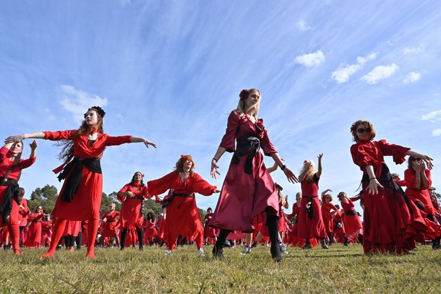 Kate Bush fans gather to dance to the singer's 1978 hit song Wuthering Heights at Sydney Park in Sydney, Saturday, July 15, 2023. Around five hundred Kate Bush fans have converged on Sydney Park dressed in their reds to dance to the singer's 1978 hit song Wuthering Heights. (Photo by Mick Tsikas/AAP Image)