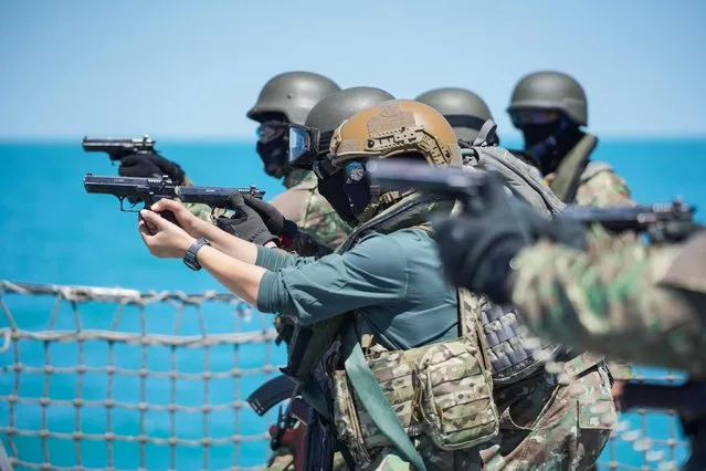 Romanian navy special forces take part in a shooting drill on the "King Ferdinand" frigate during the “Shield Protector” military exercise on the Black Sea, near Constanta, Romania, on June 22, 2022. Around 800 soldiers take part in the annual “Shield Protector” operation, a two-day drill organized by the Romanian Naval Forces, meant to consolidate the NATO combat procedures among the navy military. (Photo by Mihai Barbu/AFP Photo)
