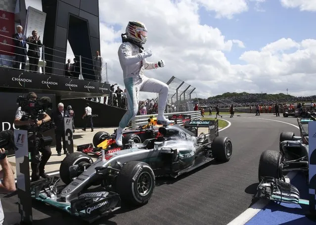 Mercedes driver Lewis Hamilton of Britain jumps from his car in celebration after winning the British Formula One Grand Prix at the Silverstone racetrack, Silverstone, England, Sunday, July 10, 2016. (Photo by Luca Bruno/AP Photo)