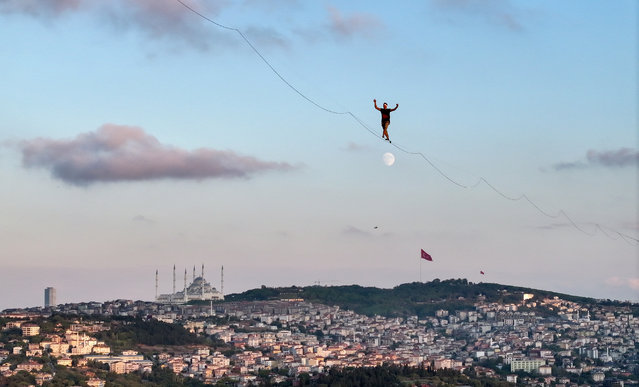 A top view shows Red Bull athlete Jaan Roose walking a tightrope from the Asian to the European continent across a bridge in Istanbul, Turkiye on September 15, 2024. (Photo by Ali Atmaca/Anadolu via Getty Images)