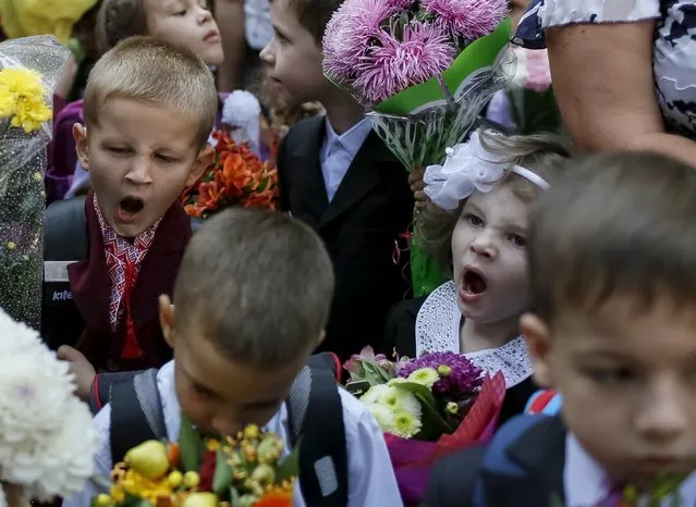 First graders yawn as they attend a ceremony to mark the start of another school year in Kiev, Ukraine, September 1, 2015. (Photo by Gleb Garanich/Reuters)