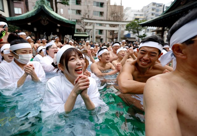 Participants bathe in ice-cold water during a ceremony at Teppozu Inari Shrine in Tokyo, Japan, 12 January 2025. 80 men and women took part in the ice water endurance ceremony to purify their souls and pray for good health in the new year. (Photo by Franck Robichon/EPA/EFE)