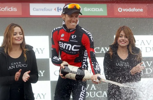 BMC Racing's Alessandro De Marchi of Italy celebrates on the podium after winning the 215km (133 miles) 14th stage of the Vuelta Tour of Spain cycling race from Vitoria to Alto Campoo, northern Spain, September 5, 2015. Fabio Aru held off a strong challenge from Joaquim Rodriguez to protect his overall lead in the Vuelta during the 14th stage. (Photo by Joseba Etxaburu/Reuters)