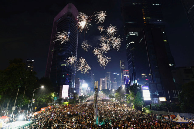 People attend New Year's Eve celebrations in Jakarta, Indonesia, on December 31, 2024. (Photo by Willy Kurniawan/Reuters)