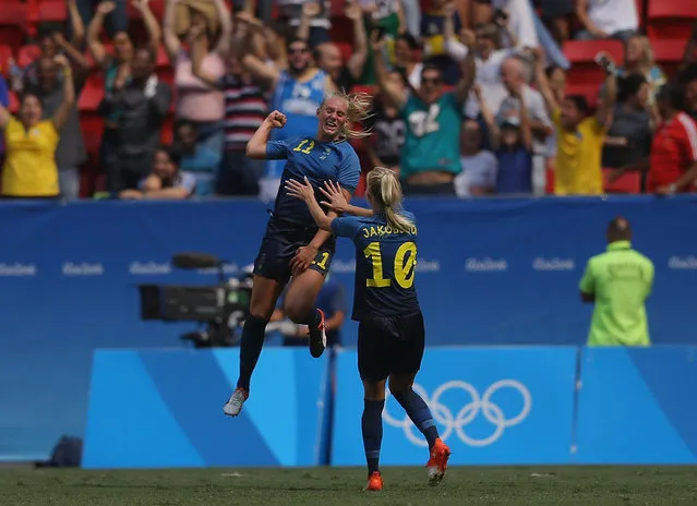 Stina Blackstenius #11 of Sweden celebrates her goal with teammate Sofia Jakobsson #10 in the second half against the United States during the Women's Football Quarterfinal match at Mane Garrincha Stadium on Day 7 of the Rio 2016 Olympic Games on August 12, 2016 in Brasilia, Brazil. (Photo by Celso Junior/Getty Images)
