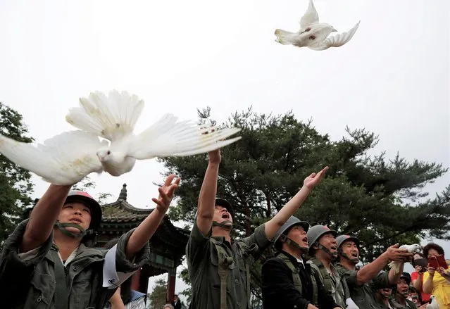Doves are released during a ceremony commemorating the 70th anniversary of the Korean War, near the demilitarized zone separating the two Koreas, in Cheorwon, South Korea, June 25, 2020. (Photo by Kim Hong-Ji/Reuters)