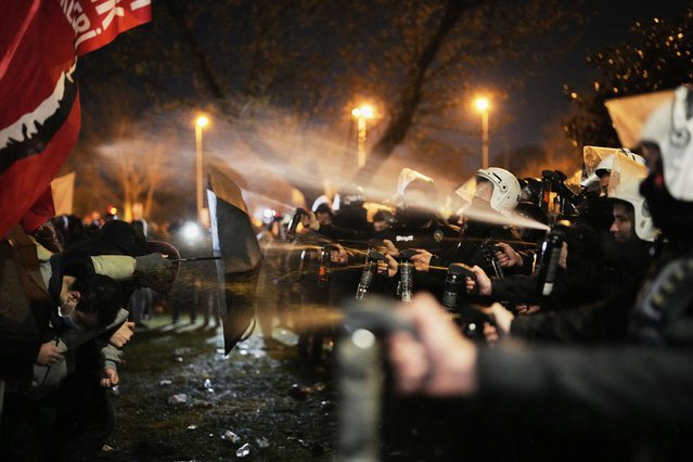 Anti-riot police officers use pepper spray during clashes with demonstrators in Istanbul, Turkey, Thursday, March 20, 2025, as they protest against the arrest of Istanbul's Mayor Ekrem Imamoglu. (Photo by Emrah Gurel/AP Photo)
