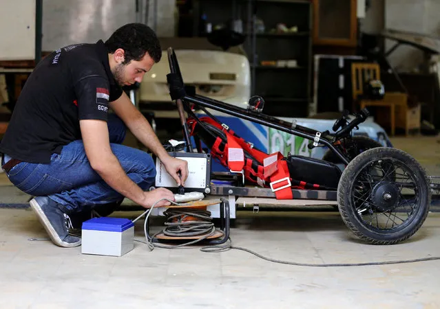 An Egyptian university student works on a hybrid racing car to compete at the Egypt's Global Hybrid-Electric Challenge in Cairo, Egypt September 2, 2016. (Photo by Mohamed Abd El Ghany/Reuters)
