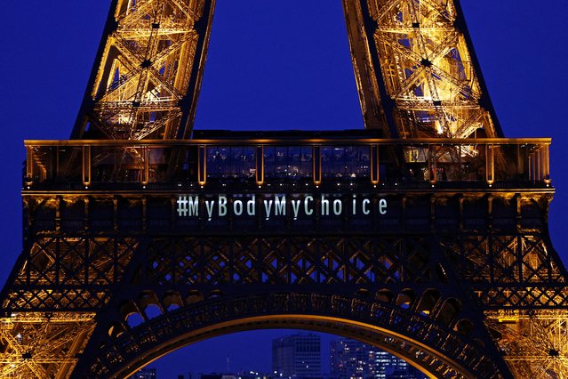 The Eiffel Tower lights up with the message “My body My choice” after French lawmakers enshrined the right to abortion in its constitution during a special congress in Versailles, in Paris, France, on March 4, 2024. (Photo by Abdul Saboor/Reuters)