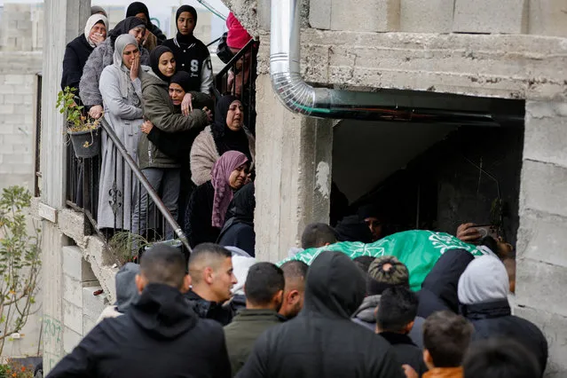 Relatives mourn during the funeral of Palestinian Fouad Abed who was killed in an Israeli raid, in Kafr-Dan village in the Israeli-occupied West Bank on January 2, 2023. (Photo by Raneen Sawafta/Reuters)