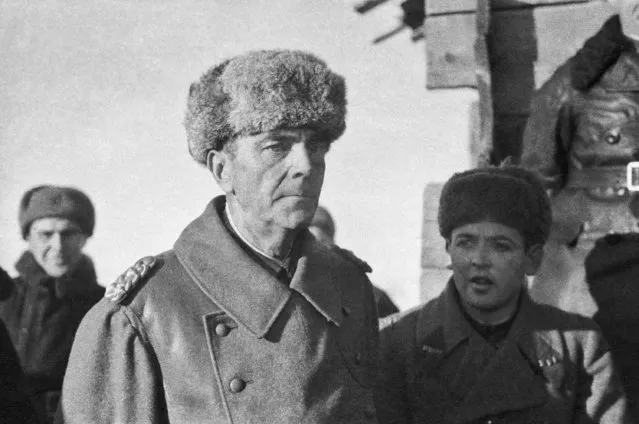 German field marshal Friedrich Paulus pictured after his capture at Stalingrad (now Volgograd), USSR in early 1943. At right is interpreter L. Bezymensky. (Photo by A. Tarantsev/TASS)
