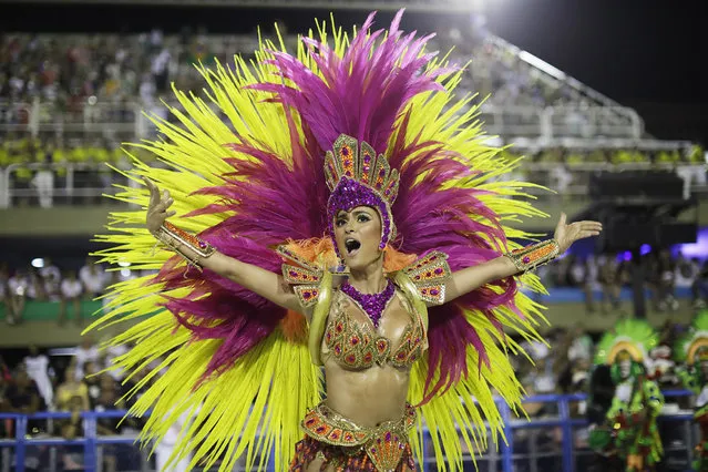 A performer from Academicos do Grande Rio samba school parades during Carnival celebrations at the Sambadrome in Rio de Janeiro, Brazil, Monday, February 12, 2018. (Photo by Leo Correa/AP Photo)